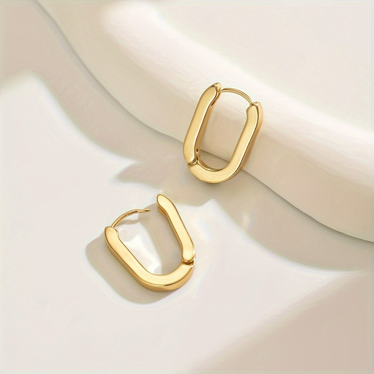 Elegante geometriske ørestikker