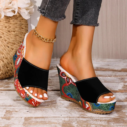 Joelle™ — Skulpturelle mules med blomsterhæl