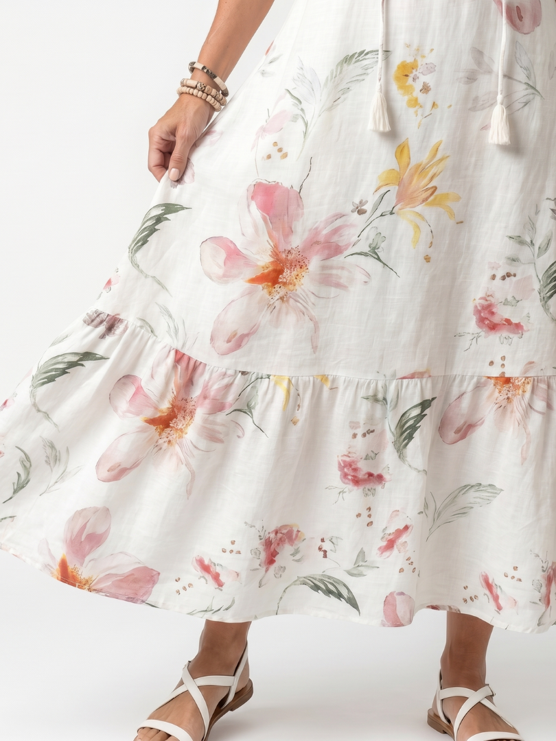 Noa | Midikjole med lag og pomponer i blødt blomsterprint