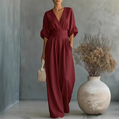Elegant kjole med V-udskæring, åben ryg og flydende ærmer - Maison Claire et Sylvie