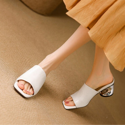 Virelle Curve mules i læder