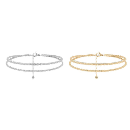 Dorelle™ — Ankelkæde med dobbelt kæde i guld og sølv, minimalistisk elegance